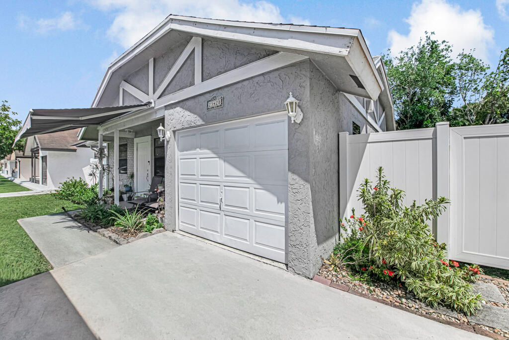 23428 Country Club Drive East Boca Raton, FL 33428 - Photo 5 of 32 a view of a house with a yard