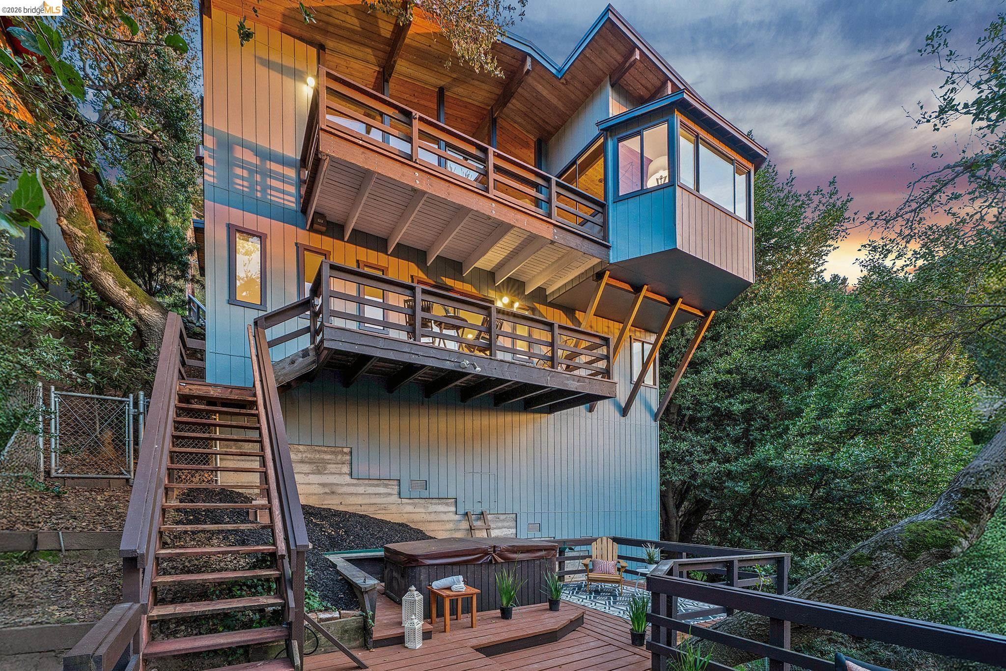 a view of a house with a small deck