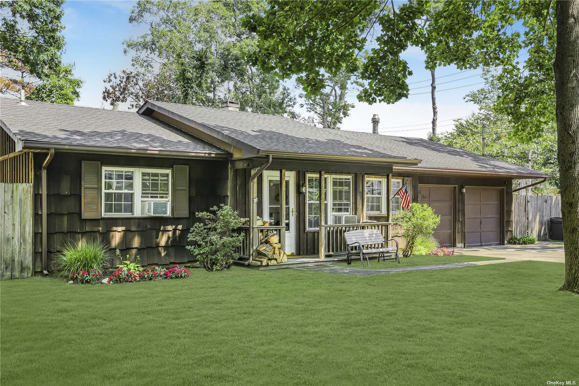 21 Windus Road Shirley, NY 11967 - Photo 1 of 1 a front view of a house with a garden and porch