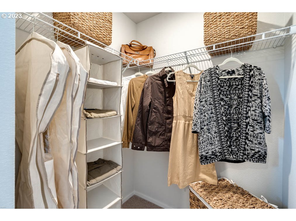 2021 Northwest 14th Street Battle Ground, WA 98604 - Photo 18 of 21 a view of walk in closet with clothes and shoes