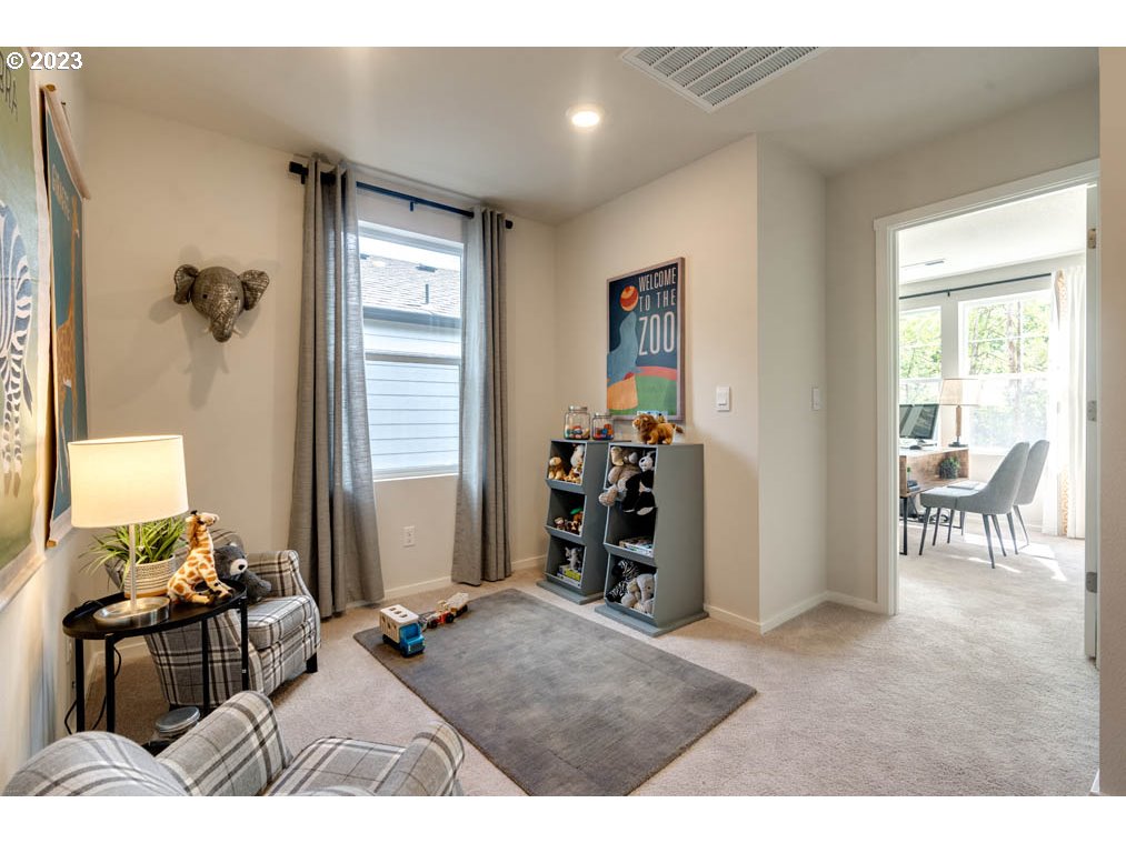 2021 Northwest 14th Street Battle Ground, WA 98604 - Photo 19 of 21 a living room with furniture a dining table and a large window