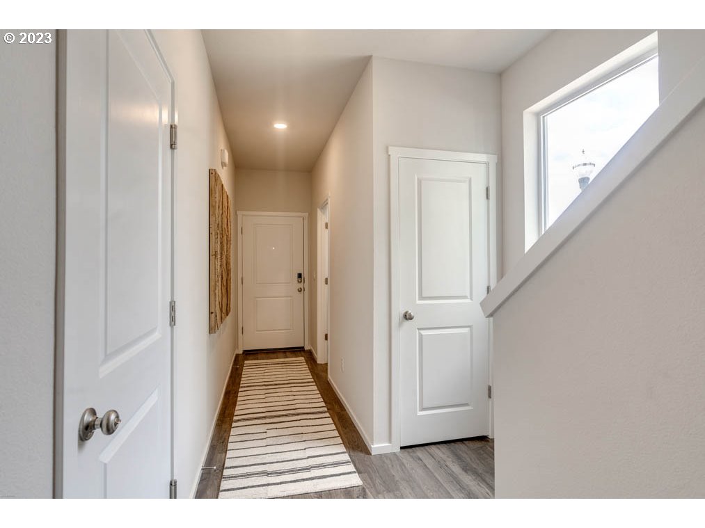 2021 Northwest 14th Street Battle Ground, WA 98604 - Photo 5 of 21 a view of a hallway with wooden floor and staircase