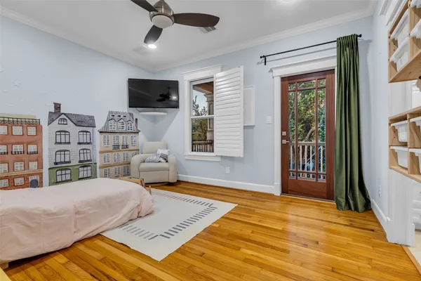 a bedroom with a bed furniture and a window