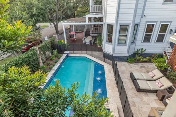 a view of swimming pool with outdoor seating