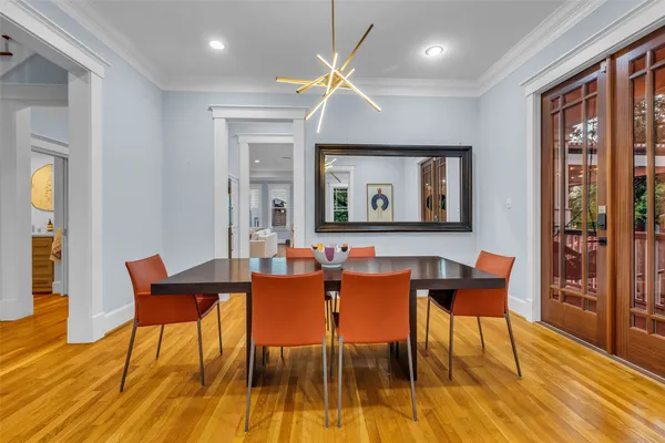 a view of a dining room with furniture and wooden floor