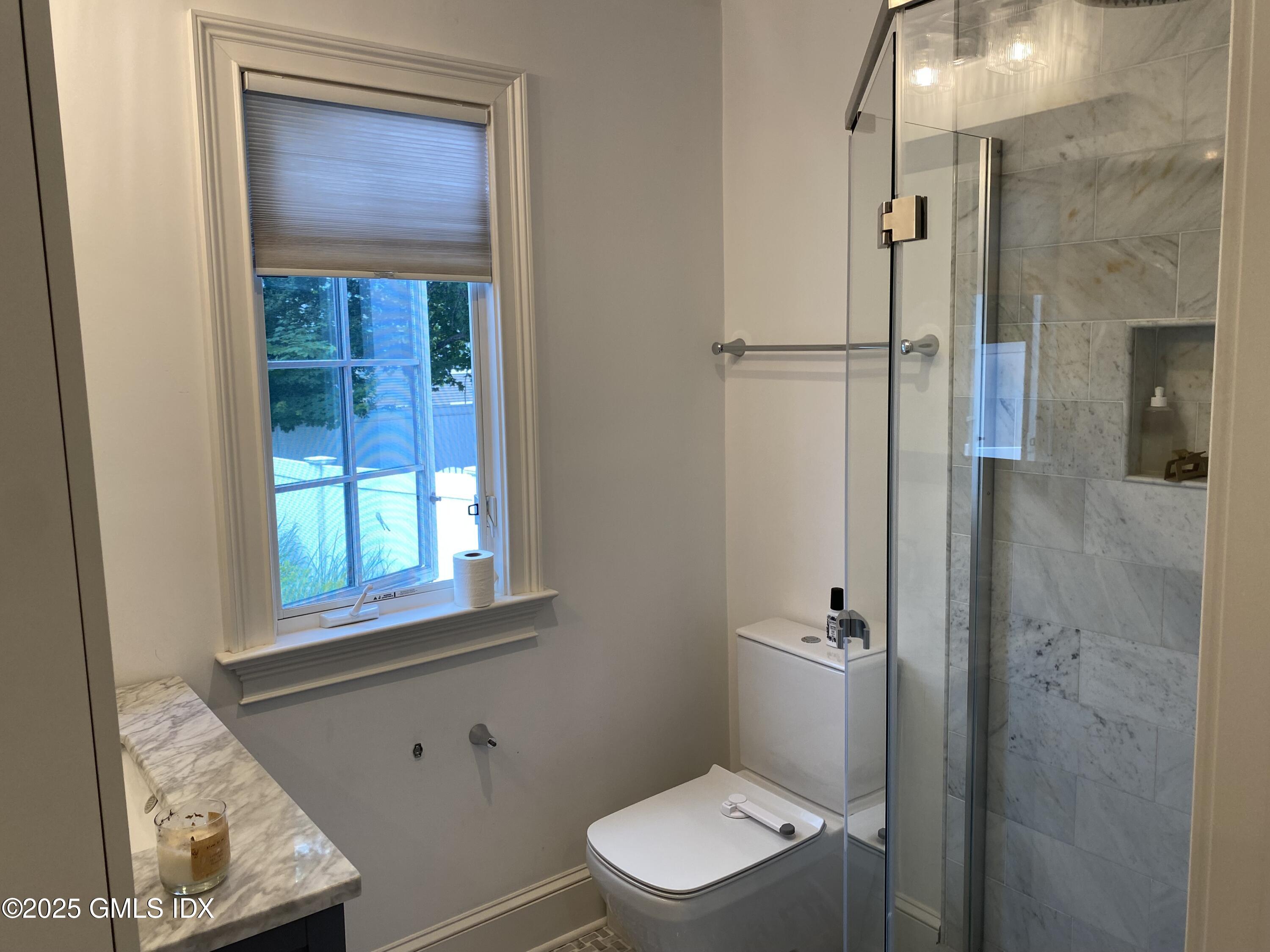 48 Richland Road Greenwich, CT 06830 - Photo 11 of 18 a bathroom with a toilet sink and shower