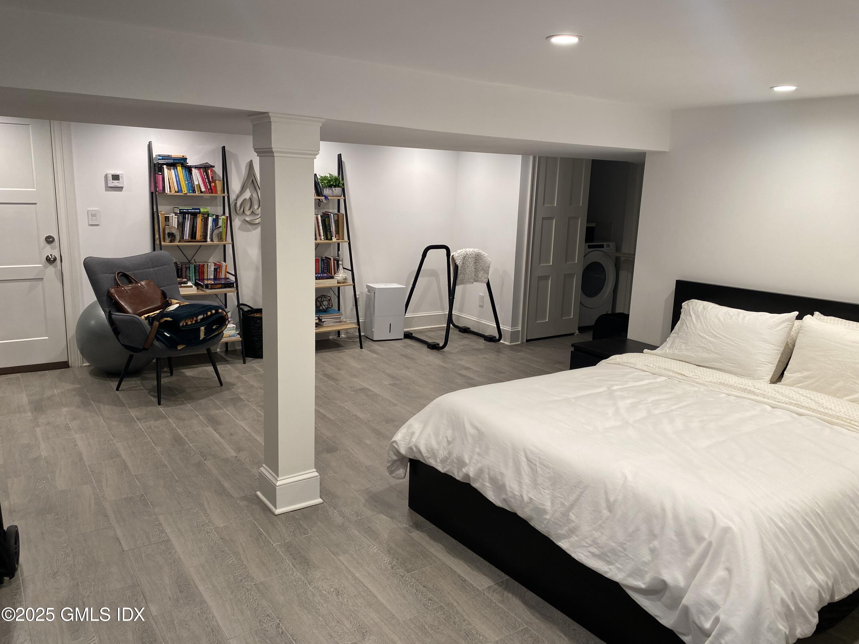 48 Richland Road Greenwich, CT 06830 - Photo 13 of 18 a spacious bedroom with a bed and a desk