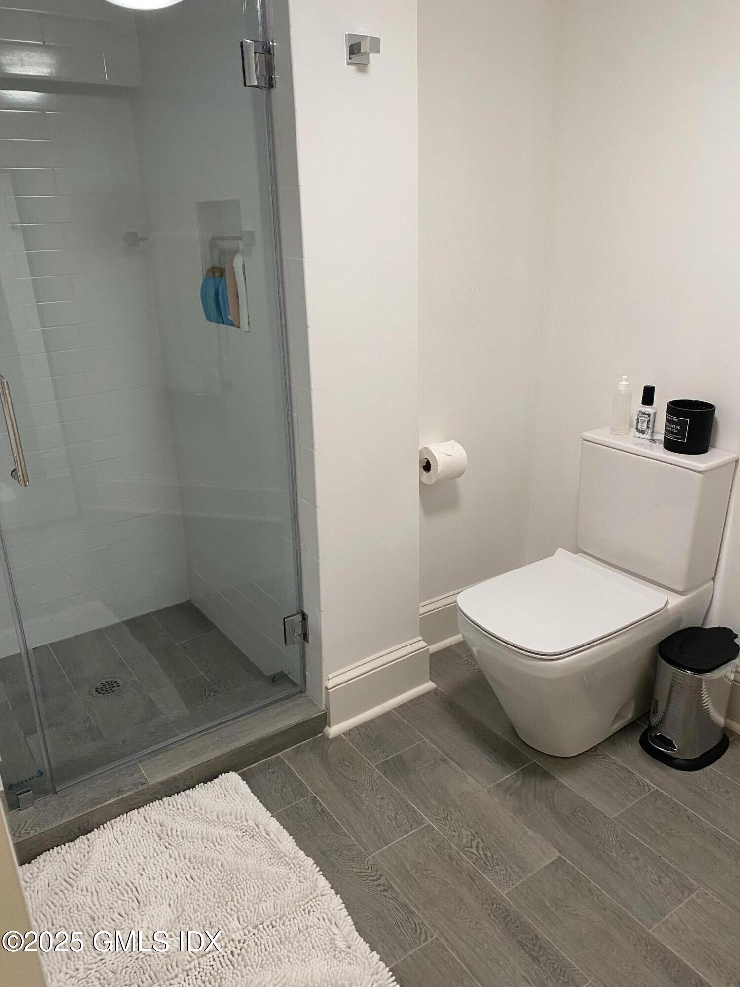 48 Richland Road Greenwich, CT 06830 - Photo 14 of 18 a white toilet sitting next to a bathroom sink