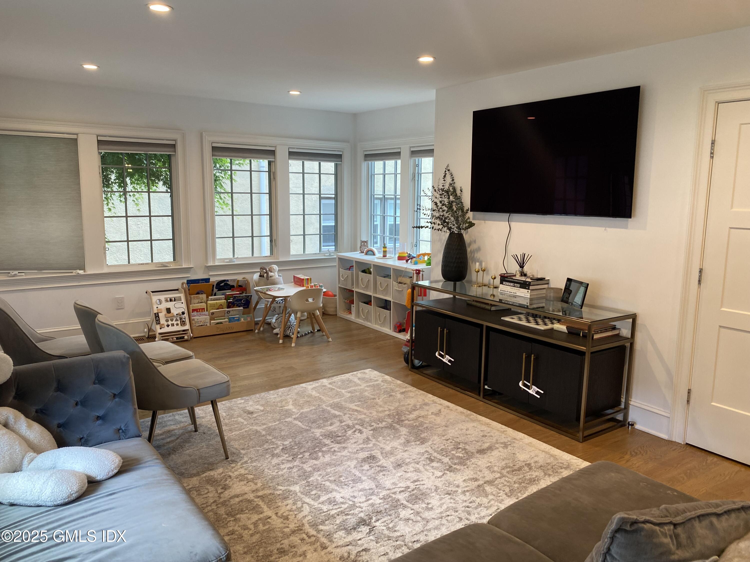48 Richland Road Greenwich, CT 06830 - Photo 17 of 18 a living room with furniture and a flat screen tv