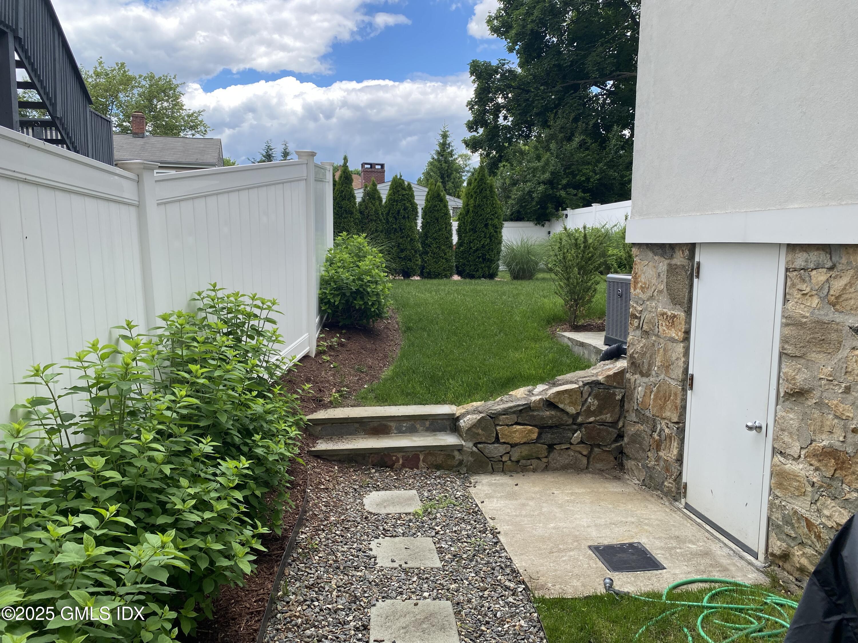 48 Richland Road Greenwich, CT 06830 - Photo 2 of 18 front view of a house with a yard