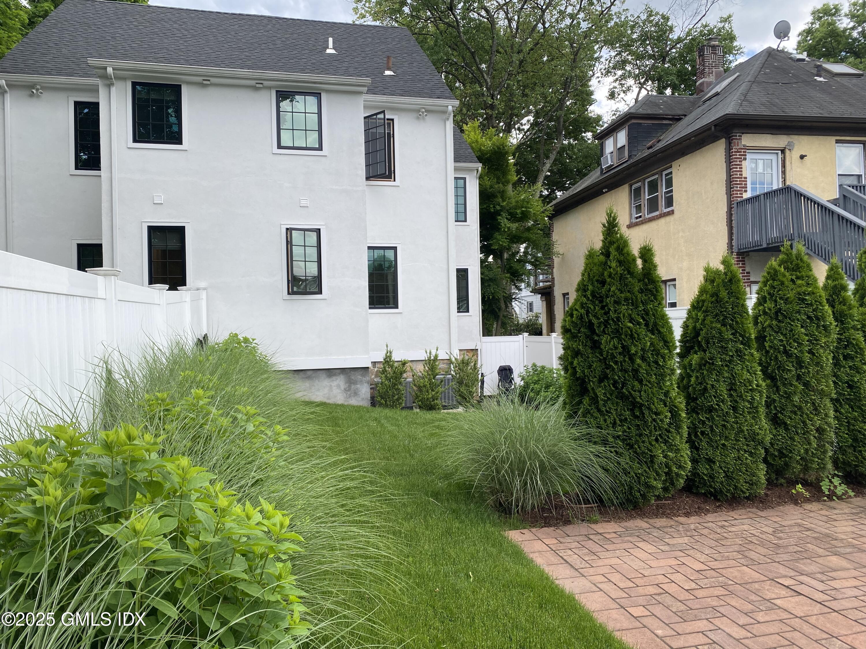48 Richland Road Greenwich, CT 06830 - Photo 3 of 18 a view of a house with a yard