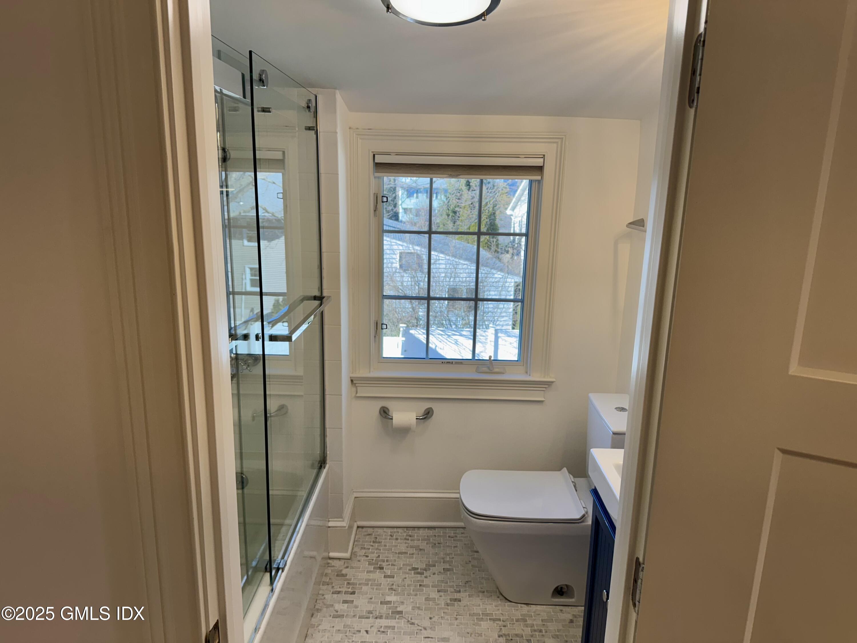 48 Richland Road Greenwich, CT 06830 - Photo 8 of 18 a bathroom with a toilet and a shower