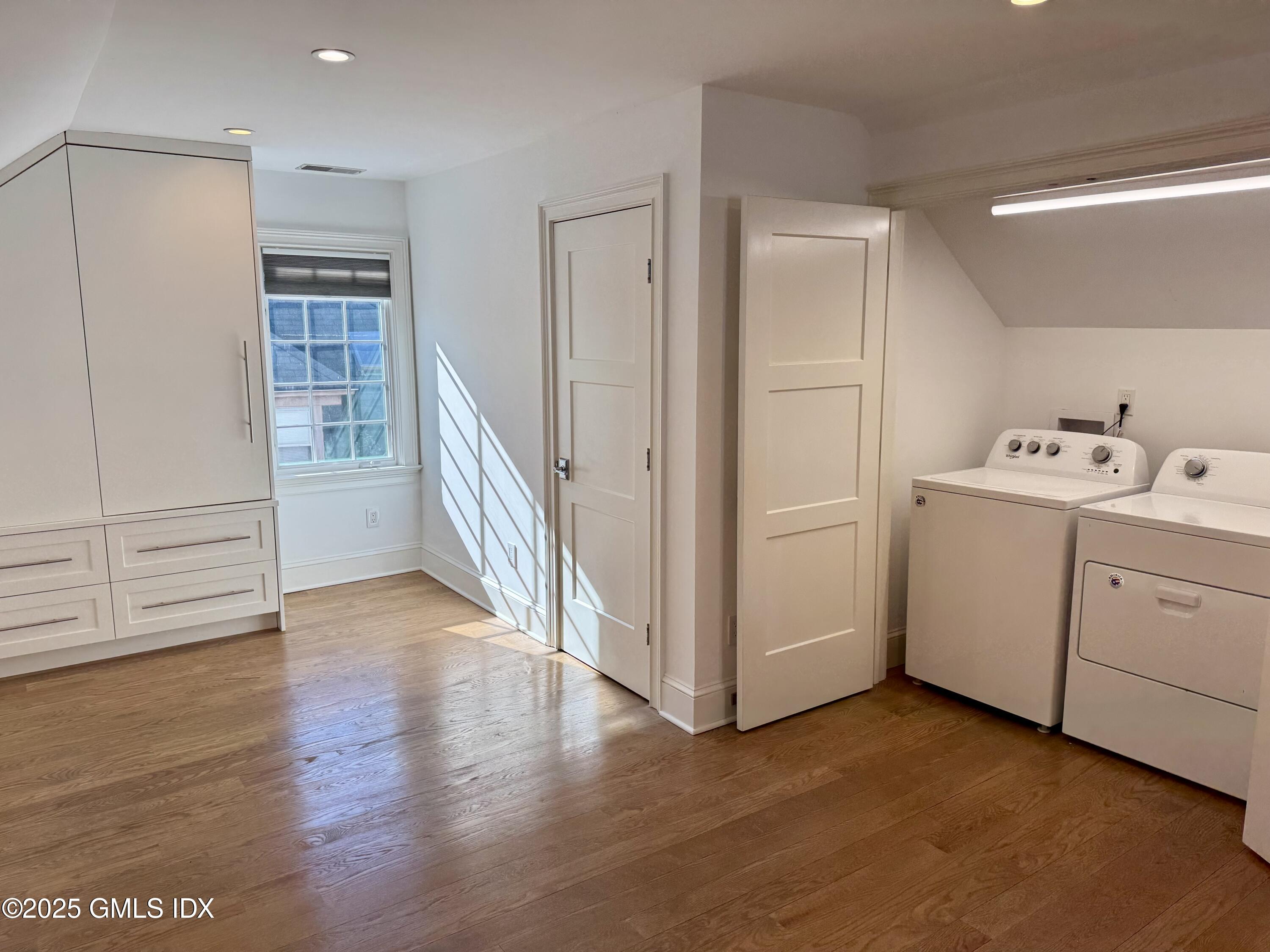 48 Richland Road Greenwich, CT 06830 - Photo 10 of 18 a view of a storage & utility room with wooden floor