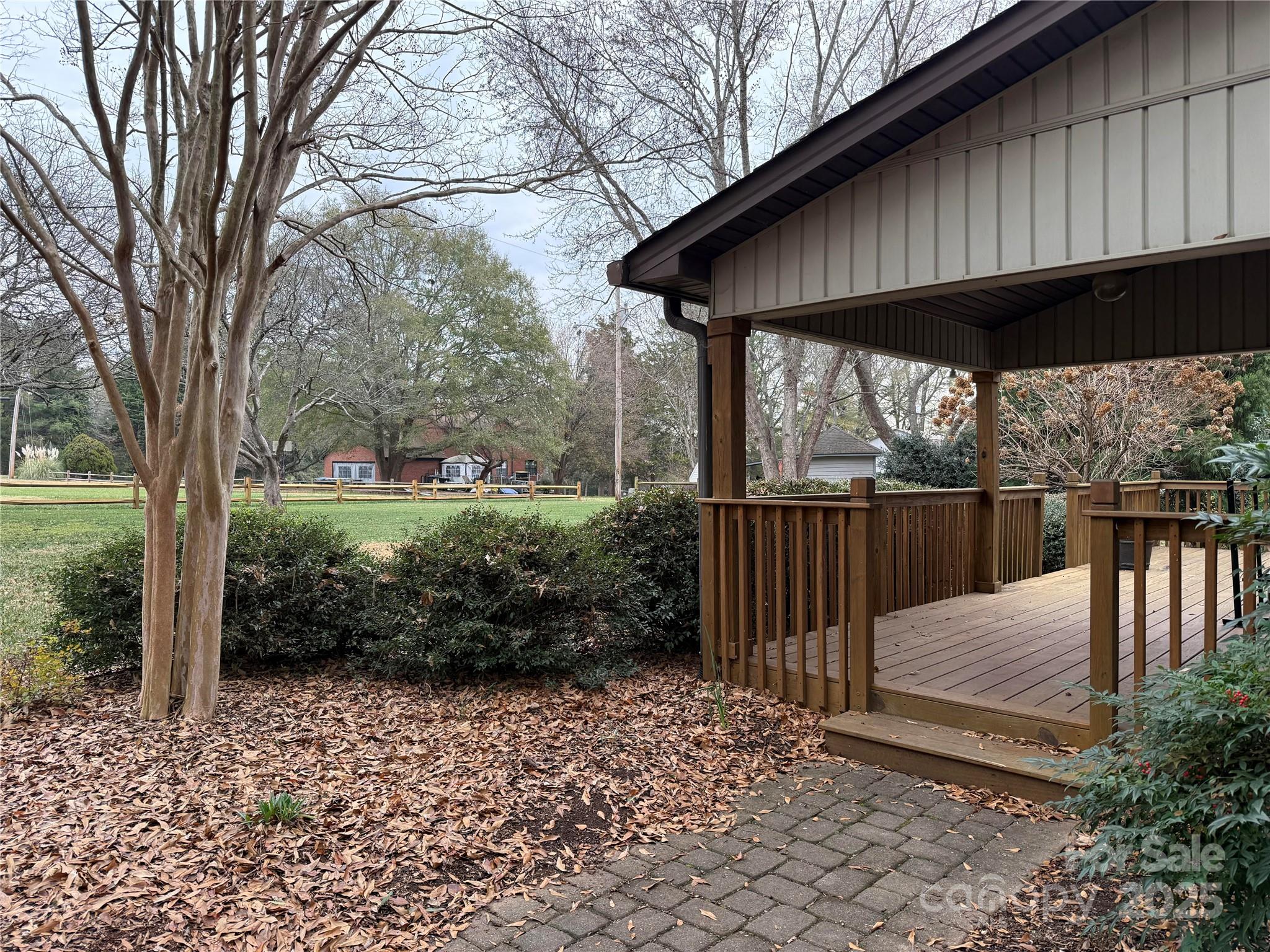 6102 Unity Lane Northwest Concord, NC 28027 - Photo 2 of 17 a view of a wooden deck next to a yard