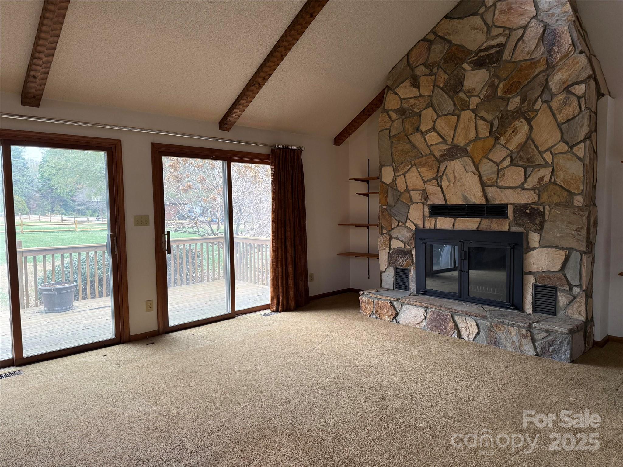 6102 Unity Lane Northwest Concord, NC 28027 - Photo 5 of 17 a view of an empty room with a fireplace