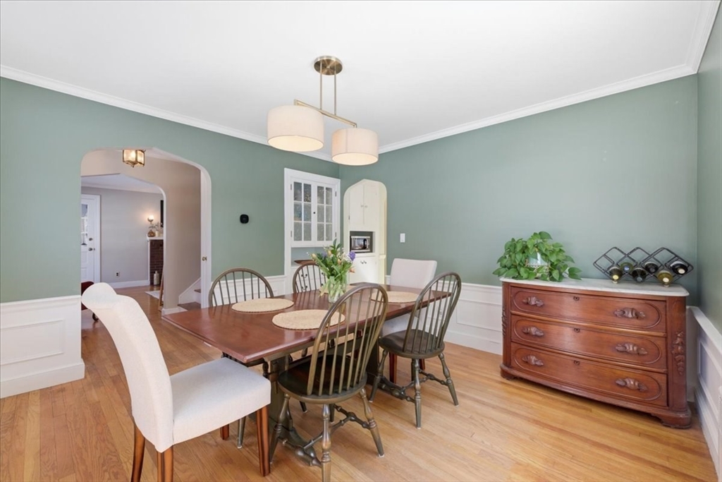 46 Park Street Dedham, MA 02026 - Photo 9 of 35 a view of a dining room with furniture and wooden floor