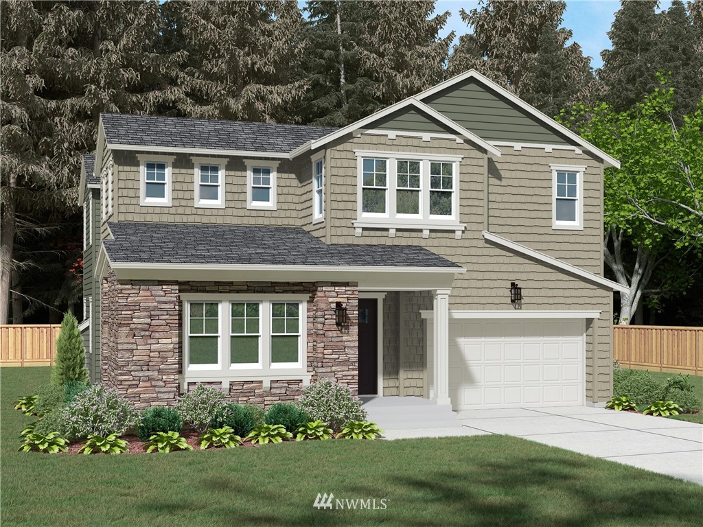 21638 35th Avenue Southeast, Unit 21 Bothell, WA 98021 - Photo 1 of 25 a front view of a house with a yard and garage