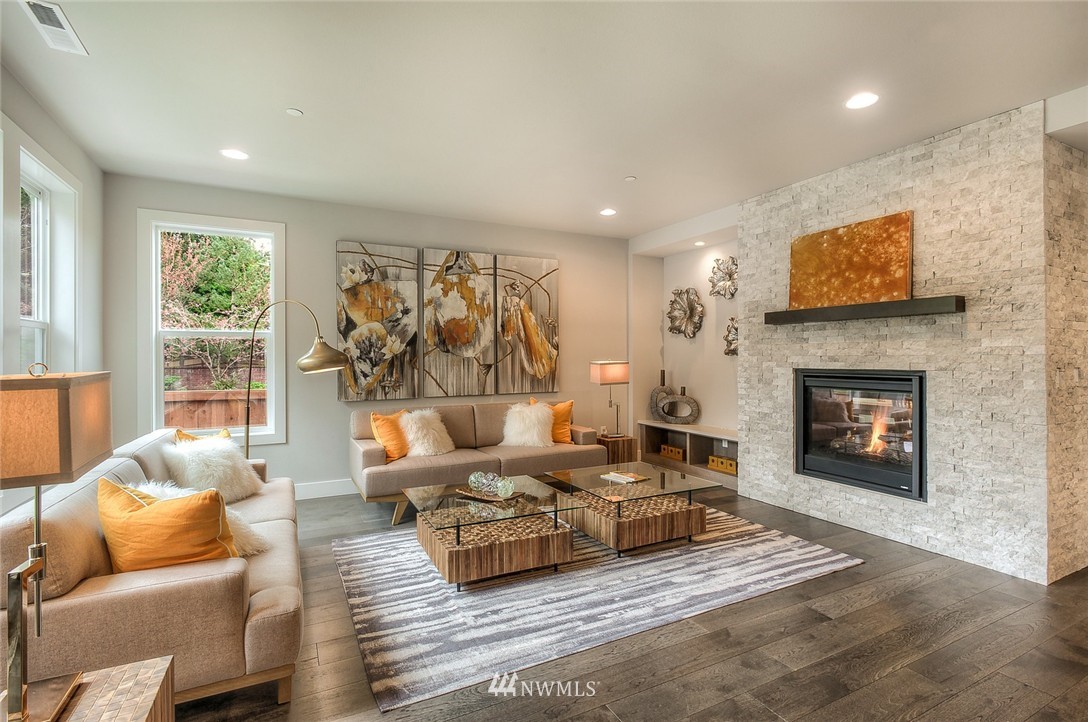 21638 35th Avenue Southeast, Unit 21 Bothell, WA 98021 - Photo 15 of 25 a living room with furniture and a fireplace