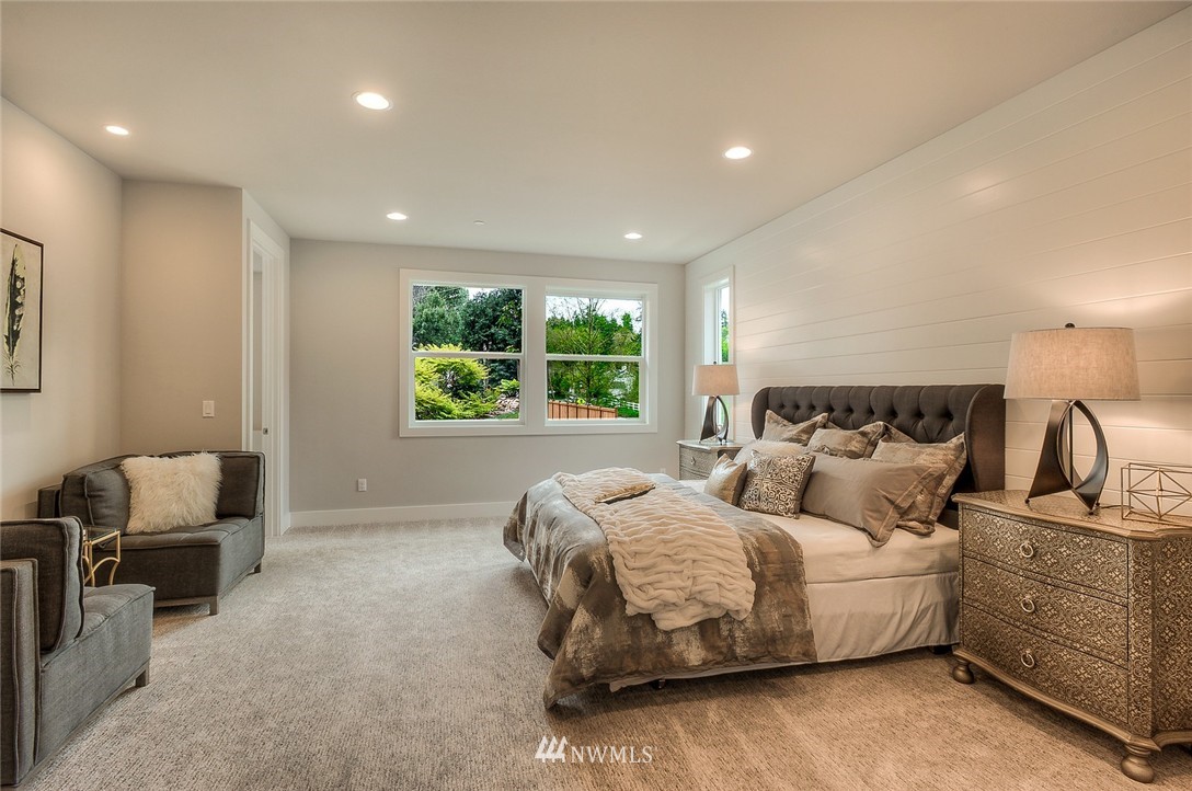21638 35th Avenue Southeast, Unit 21 Bothell, WA 98021 - Photo 19 of 25 a bedroom with bed and window