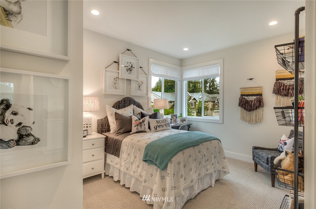 21638 35th Avenue Southeast, Unit 21 Bothell, WA 98021 - Photo 20 of 25 a bedroom with a bed and a window