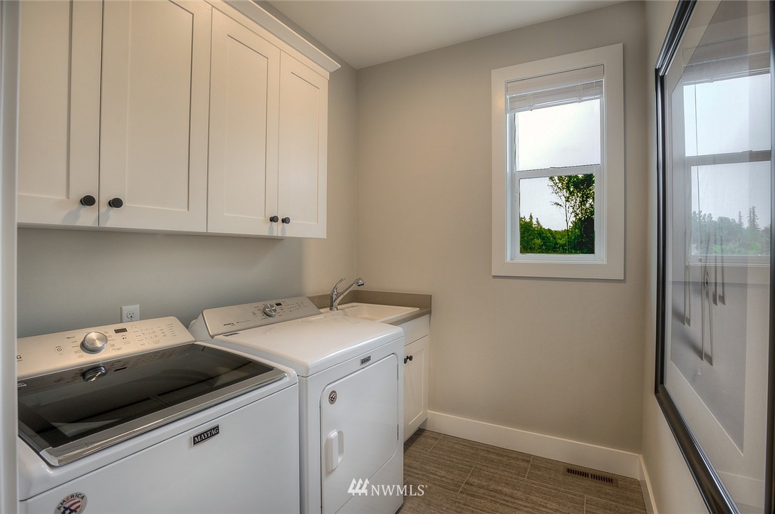 21638 35th Avenue Southeast, Unit 21 Bothell, WA 98021 - Photo 24 of 25 a utility room with dryer and washer