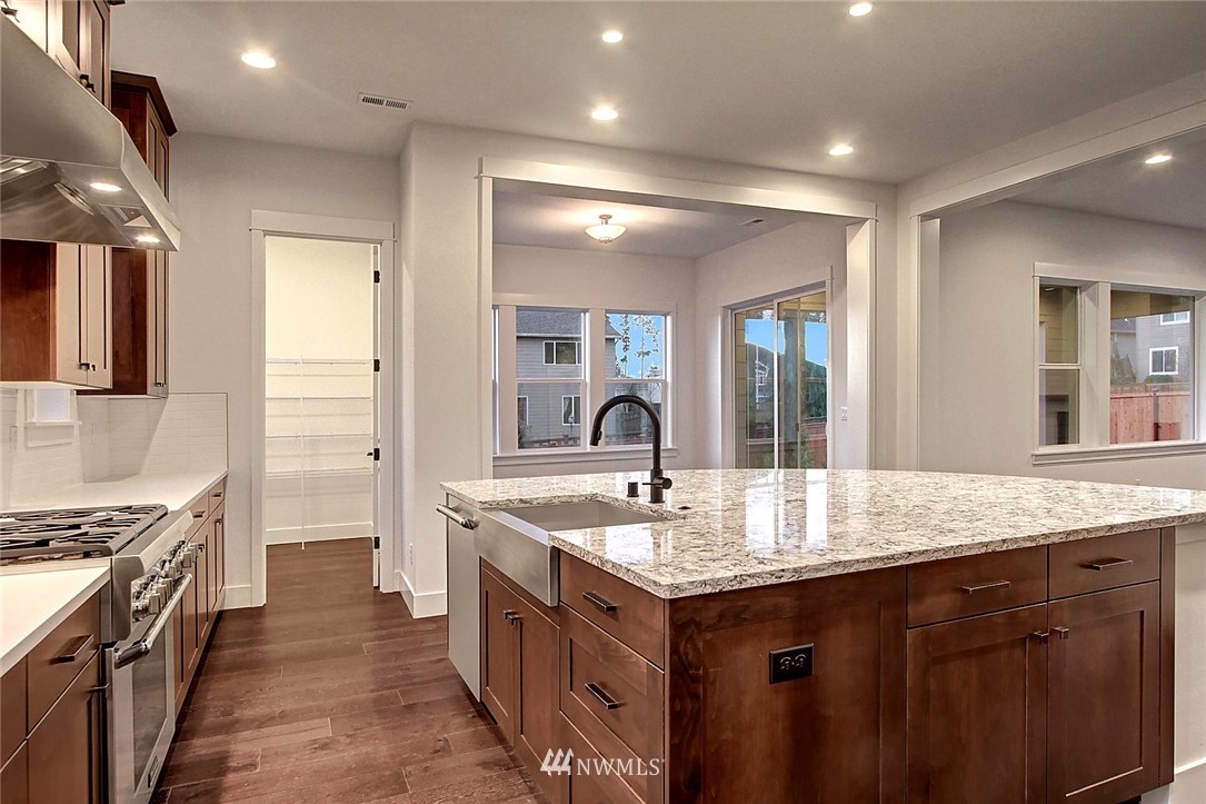 21638 35th Avenue Southeast, Unit 21 Bothell, WA 98021 - Photo 6 of 25 a kitchen with sink stove and refrigerator