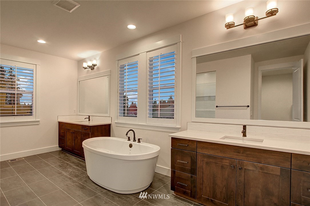 21638 35th Avenue Southeast, Unit 21 Bothell, WA 98021 - Photo 9 of 25 a bathroom with a sink and a bathtub
