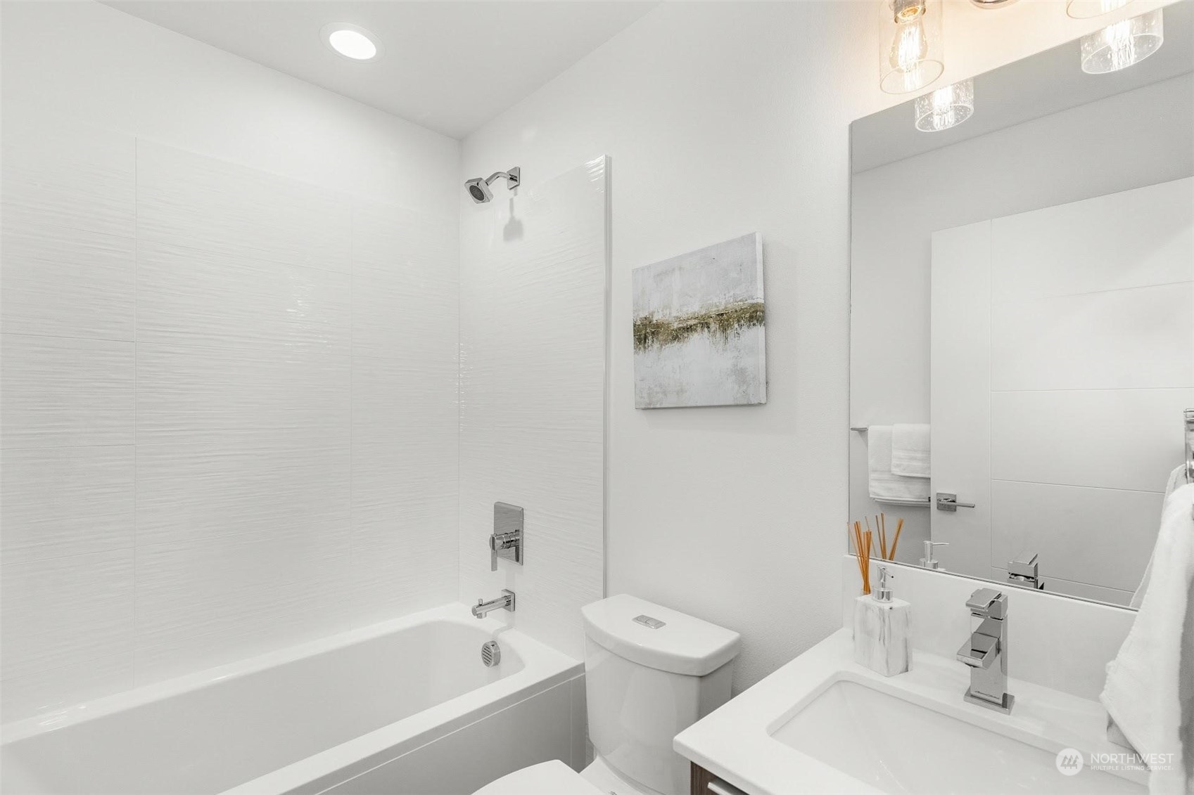 10152 Holman Road Northwest Seattle, WA 98133 - Photo 13 of 24 a bath room with a toilet sink and a bath tub