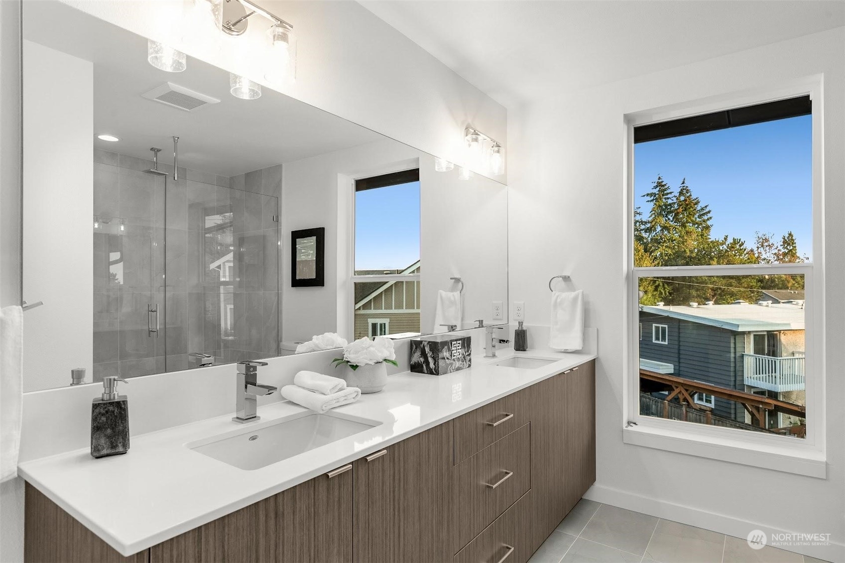 10152 Holman Road Northwest Seattle, WA 98133 - Photo 16 of 24 a bathroom with a double vanity sink mirror and double