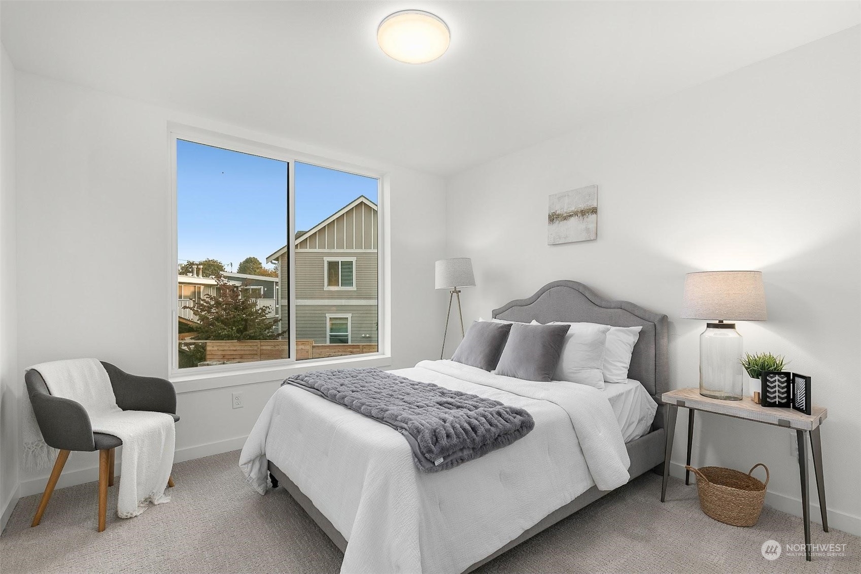 10152 Holman Road Northwest Seattle, WA 98133 - Photo 10 of 24 a bedroom with a large bed and a window