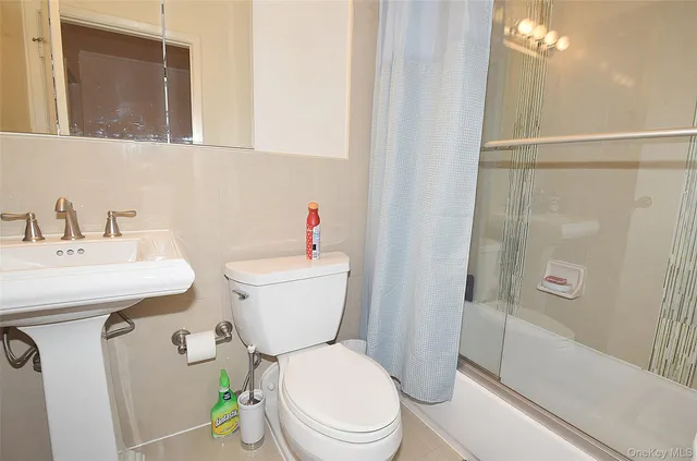 a bedroom with a bed and flat screen tv