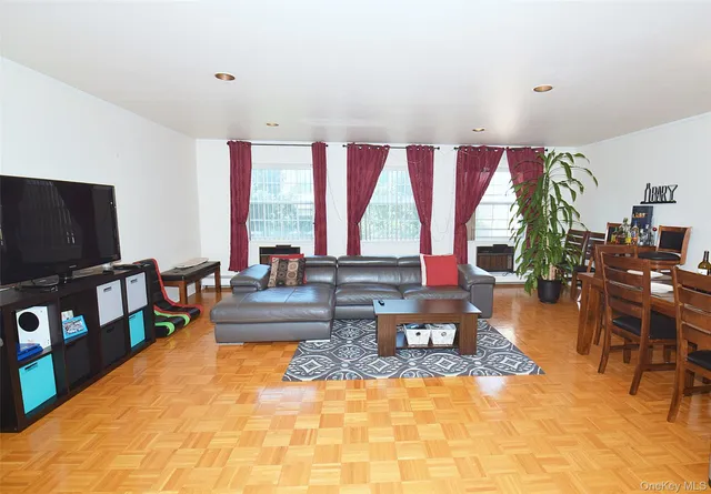 a living room with fireplace furniture and a flat screen tv