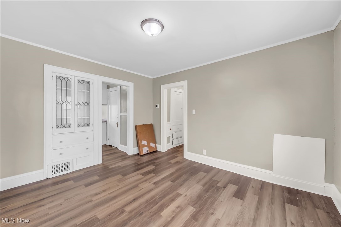3528 Daleford Road Cleveland, OH 44120 - Photo 12 of 30 Unfurnished bedroom with wood finished floors, crown molding, and baseboards