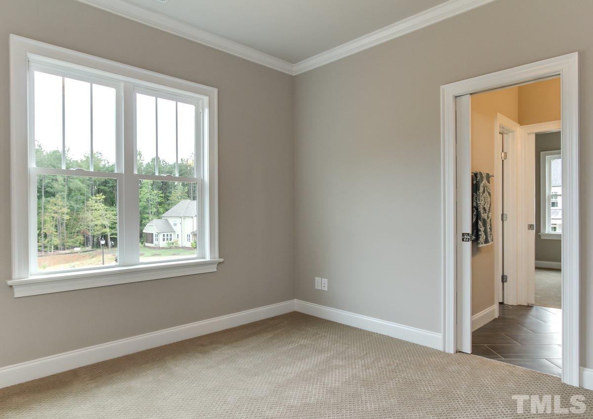 8808 Breeland Way Raleigh, NC 27613 - Photo 22 of 25 an empty room with a window