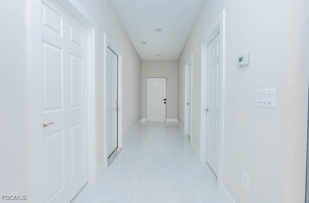 4419 22nd Street Southwest Lehigh Acres, FL 33973 - Photo 25 of 31 a view of a hallway