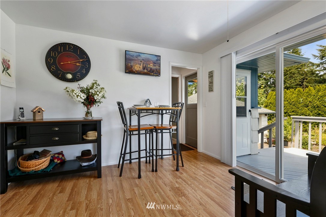 717 224th Street Southwest Bothell, WA 98021 - Photo 11 of 40 a view of a dining room with furniture and wooden floor