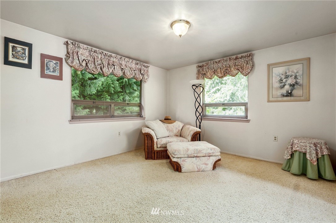 717 224th Street Southwest Bothell, WA 98021 - Photo 17 of 40 a bedroom with furniture and a large window