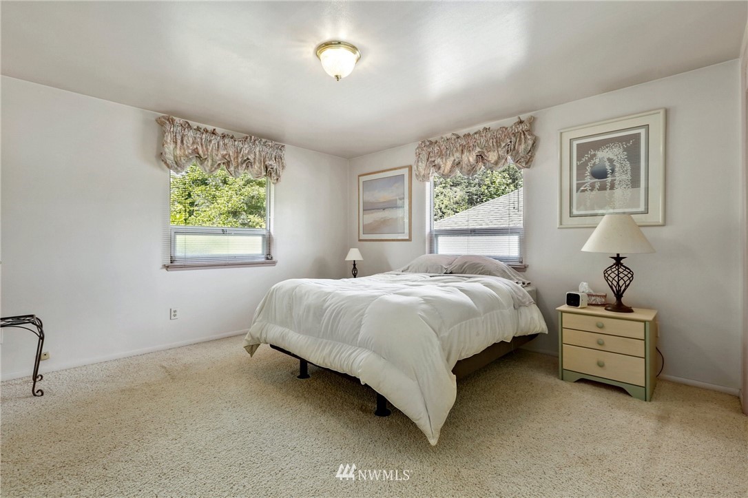 717 224th Street Southwest Bothell, WA 98021 - Photo 18 of 40 a spacious bedroom with a bed and window