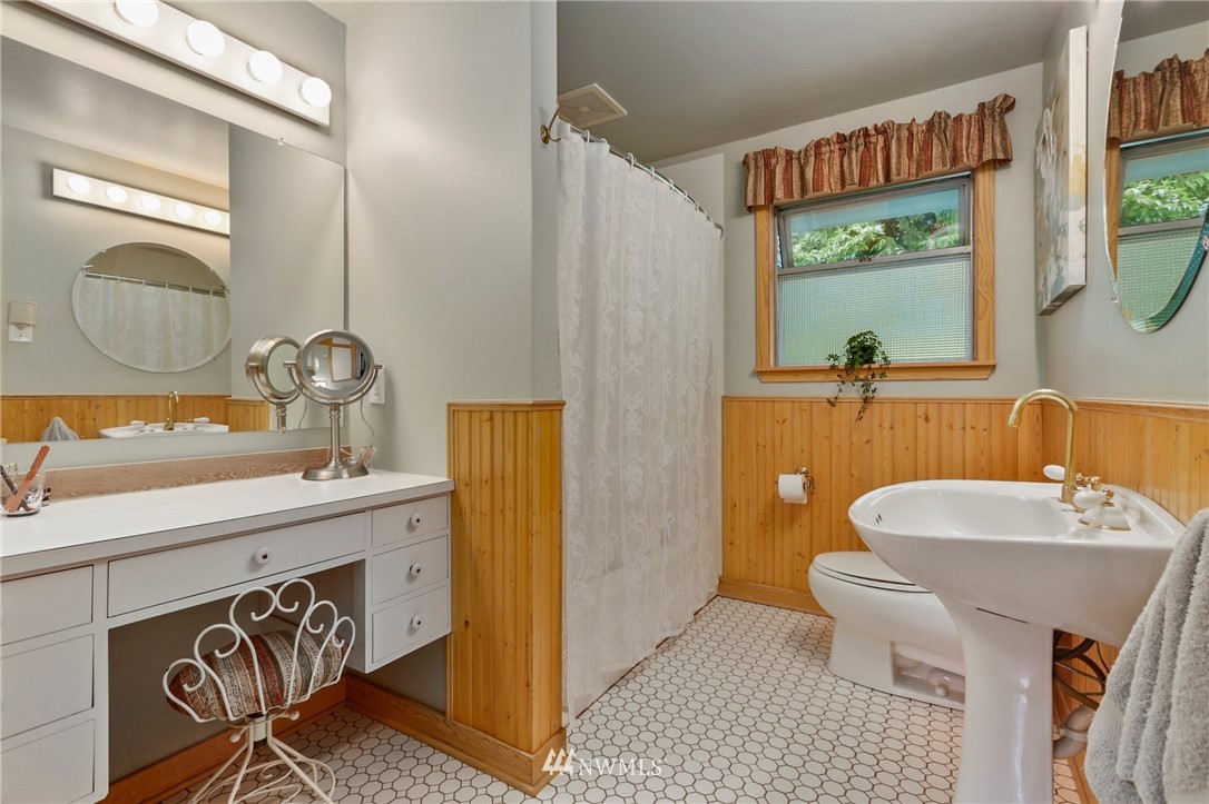 717 224th Street Southwest Bothell, WA 98021 - Photo 19 of 40 a bathroom with a sink a toilet and a mirror