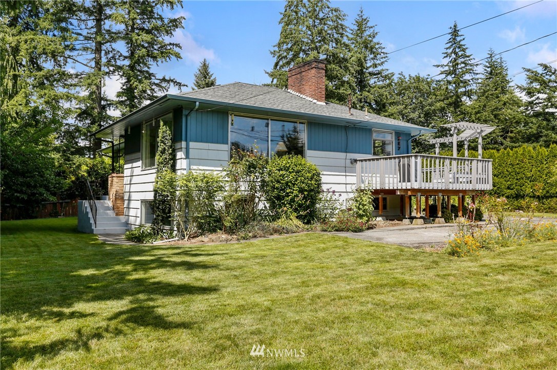 717 224th Street Southwest Bothell, WA 98021 - Photo 3 of 40 a front view of a house with a yard
