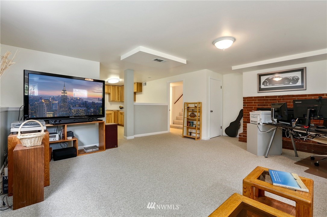 717 224th Street Southwest Bothell, WA 98021 - Photo 21 of 40 a view of a livingroom with furniture and a flat screen tv