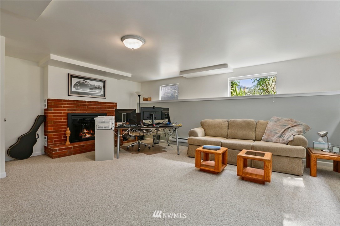 717 224th Street Southwest Bothell, WA 98021 - Photo 22 of 40 a living room with furniture and a fireplace