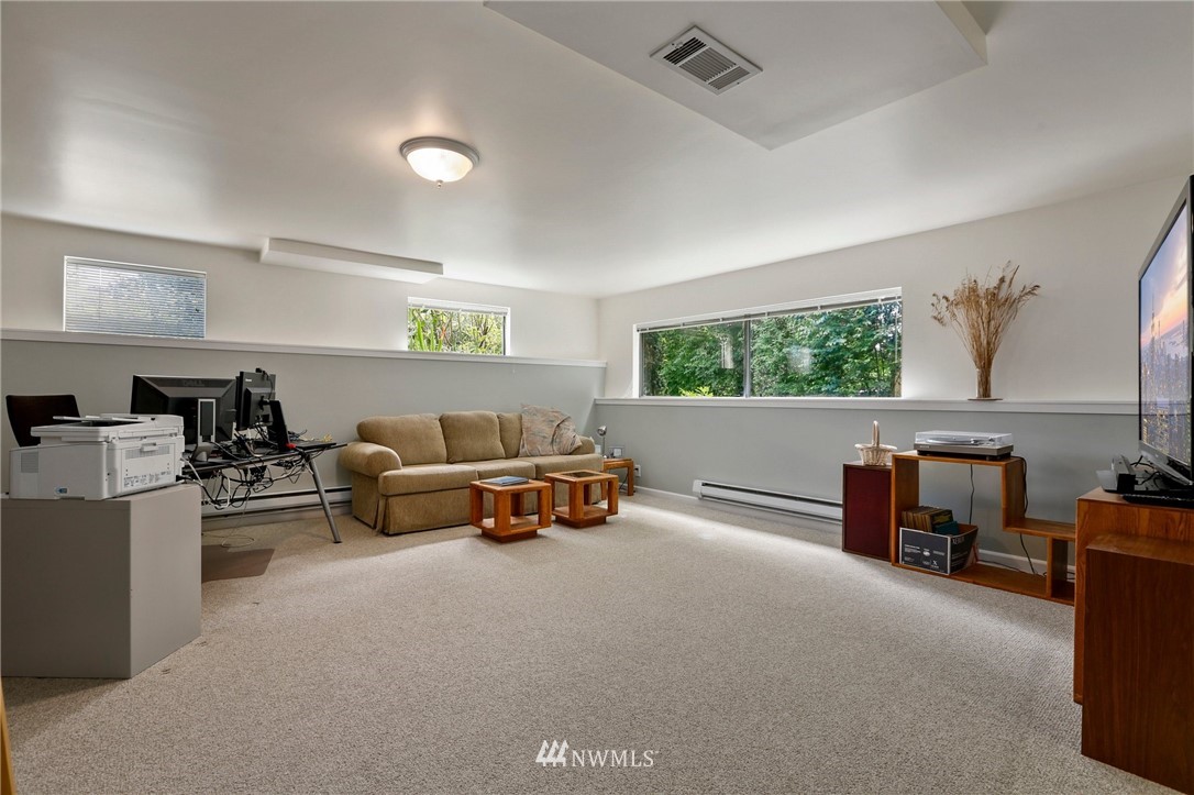 717 224th Street Southwest Bothell, WA 98021 - Photo 23 of 40 a living room with furniture and a window