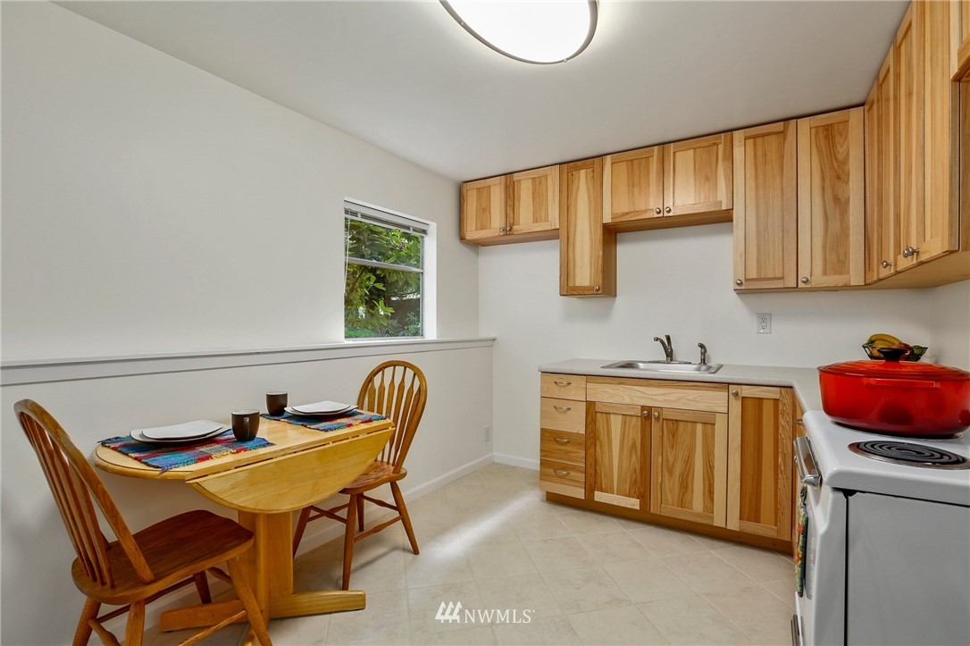 717 224th Street Southwest Bothell, WA 98021 - Photo 25 of 40 a kitchen with stainless steel appliances granite countertop a sink and cabinets