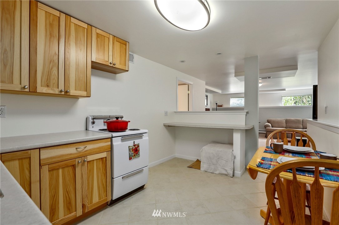 717 224th Street Southwest Bothell, WA 98021 - Photo 26 of 40 a utility room with stainless steel appliances granite countertop a stove and a sink