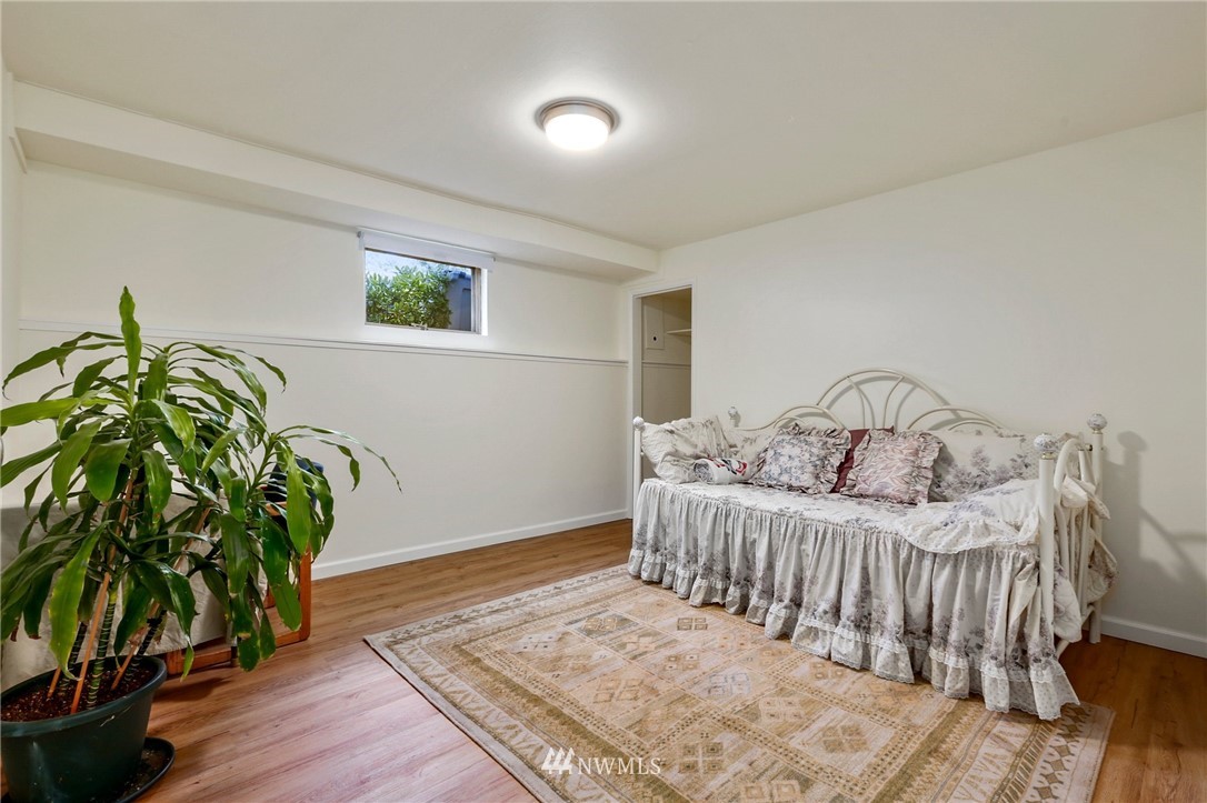 717 224th Street Southwest Bothell, WA 98021 - Photo 27 of 40 a bedroom with a bed table and a potted plant