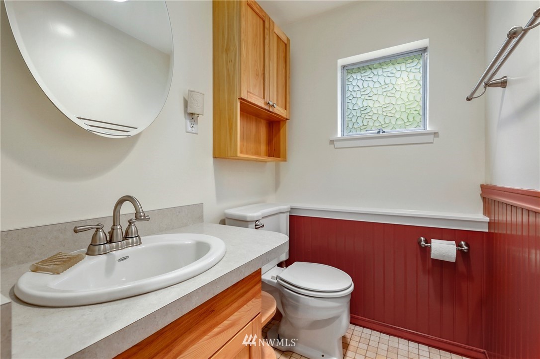717 224th Street Southwest Bothell, WA 98021 - Photo 30 of 40 a bathroom with a toilet a sink and a mirror