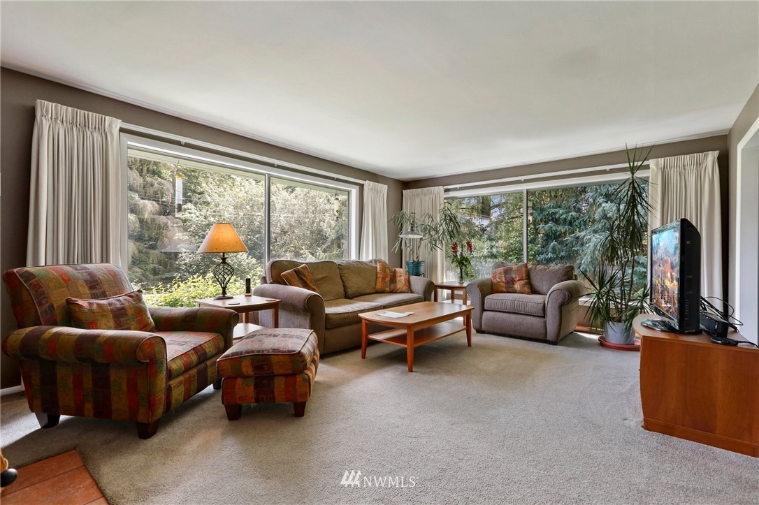 717 224th Street Southwest Bothell, WA 98021 - Photo 4 of 40 a living room with furniture and a flat screen tv