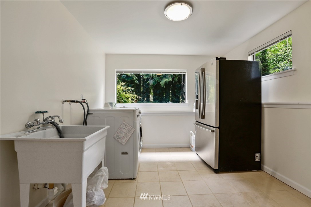 717 224th Street Southwest Bothell, WA 98021 - Photo 31 of 40 a kitchen with a refrigerator and a sink