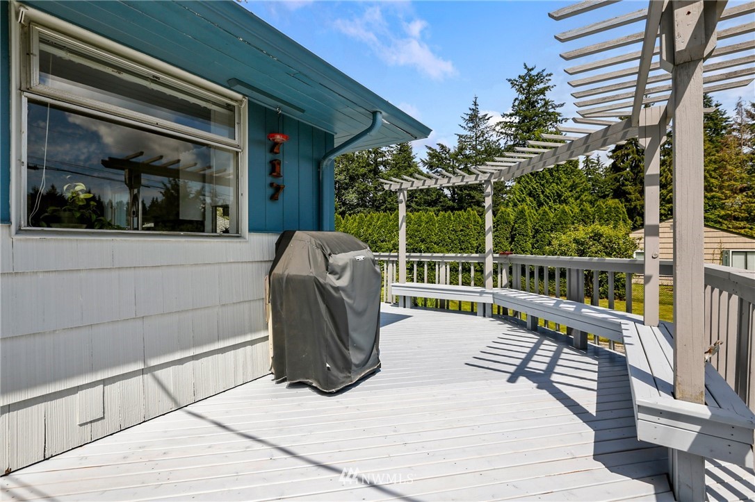 717 224th Street Southwest Bothell, WA 98021 - Photo 32 of 40 a view of a chair and tables in the balcony